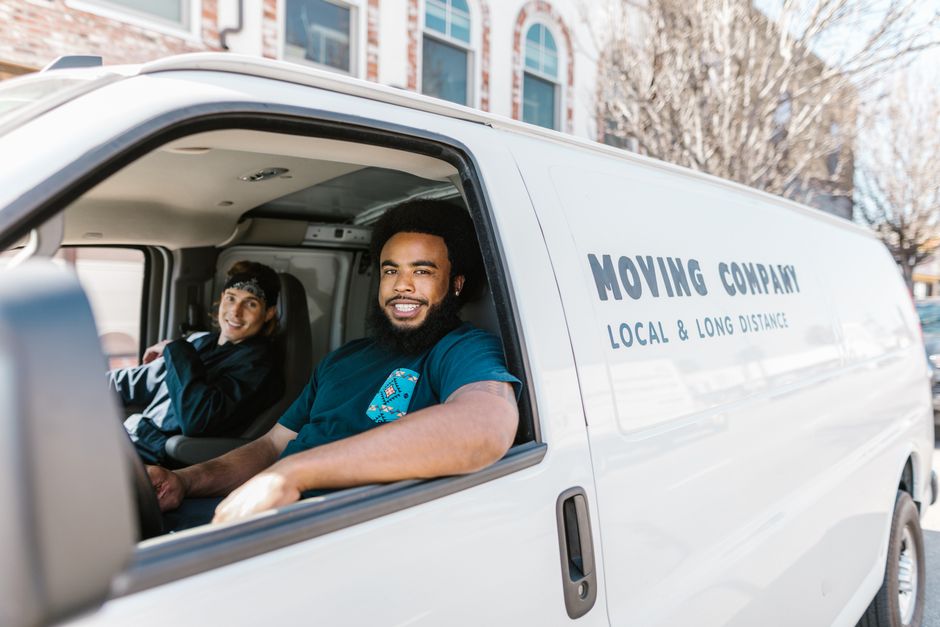 Friendly team of professional movers smiling and ready to assist