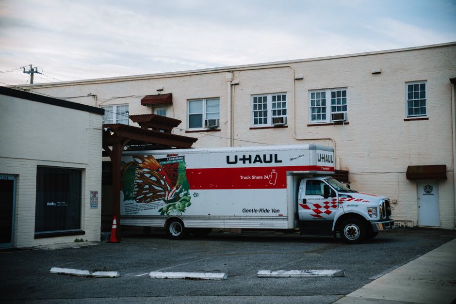 Professional moving truck outside a residential home ready for loading